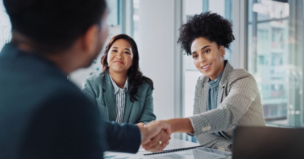 Employees using Addison Group's advice to avoid common hiring mistakes.
