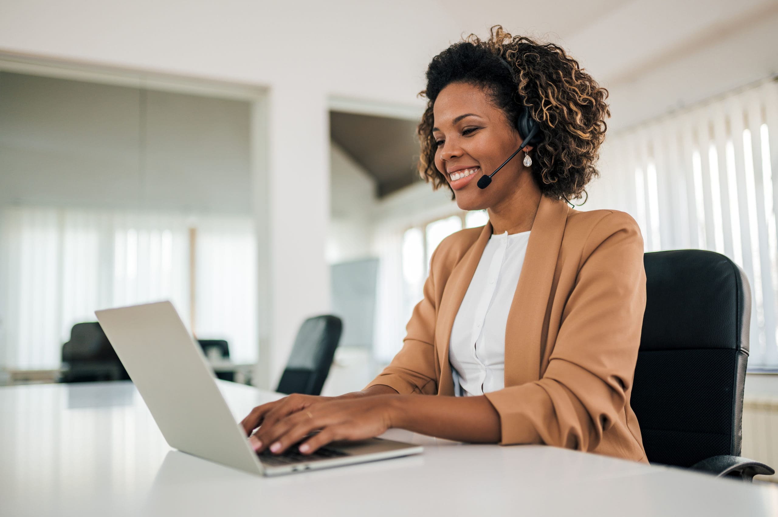 Woman Smiles During Virtual Interview